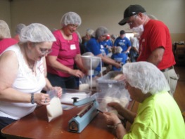 Susan Reith Swan (at left) with friend Janice White (in the pink shirt) at our aid packing station.